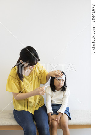 Girl catching a cold 58441678