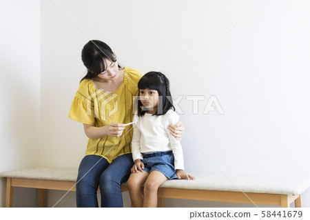 Girl catching a cold 58441679