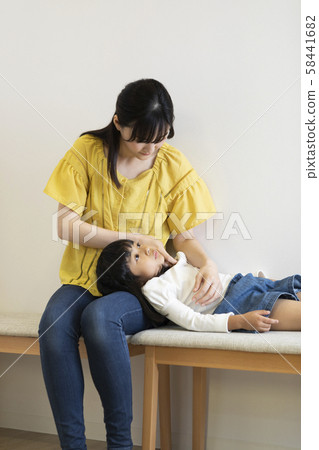 Girl catching a cold 58441682