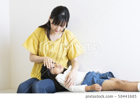 Girl catching a cold 58441685