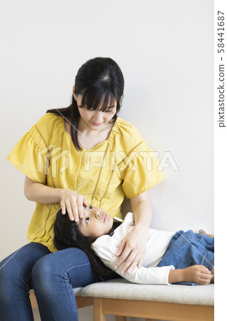 Girl catching a cold 58441687