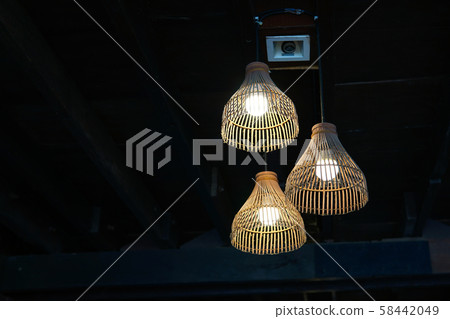The lamp is made from bamboo. The lamp is made from bamboo. 58442049