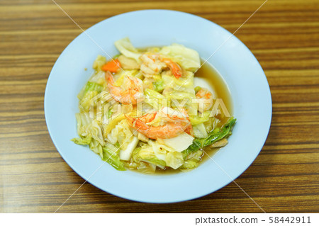 Fried vegetables with shrimp on white dish 58442911