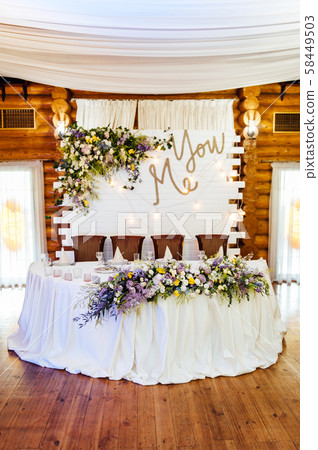 Luxurious wedding presidium in white with silver elements. Luxurious wedding presidium in white with silver elements. 58449503