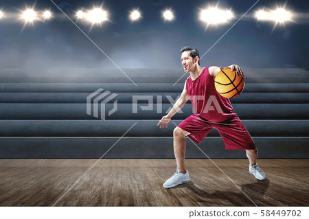 Asian man basketball player playing basketball 58449702