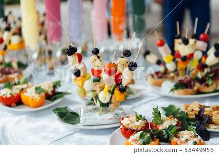 catering services background with snacks on guests table in restaurant at event party catering services background with snacks on guests table in restaurant at event party 58449956