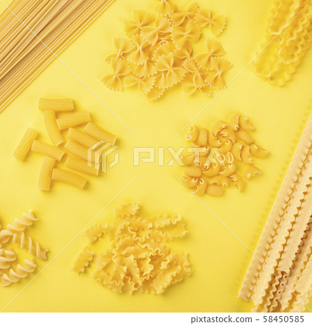 Italian pasta pattern, shot from above on a yellow background, a flat lay square banner 58450585