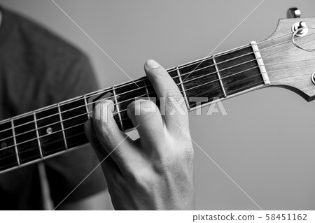 Musicians are catching guitar chords. 58451162