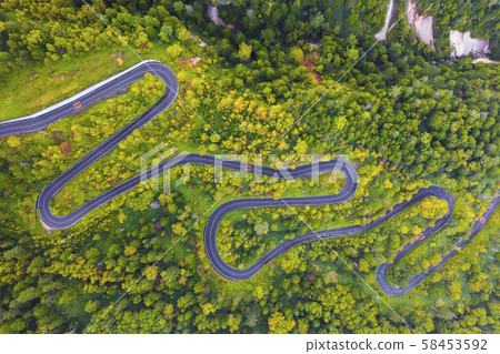 Aerial view of winding road on mountain in Autumn 58453592