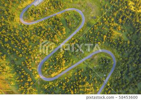 Aerial view of winding road on mountain in Autumn Aerial view of winding road on mountain in Autumn 58453600
