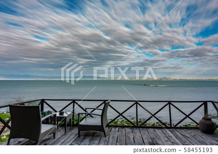 Sunrise at lake Malawi with cloudy sky, long exposure 58455193