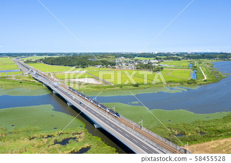 A photo shoot of Keisei Skyliner and National Route 464 crossing Inba-numa in Chiba Prefecture 58455528