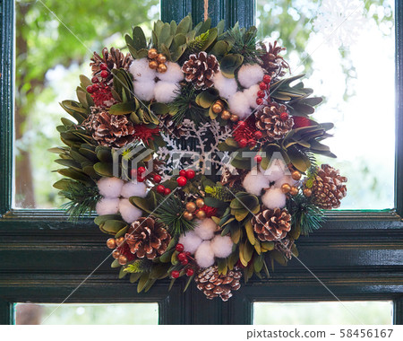 Christmas wreath on the house door Christmas wreath on the house door 58456167