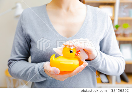 Caring for toys, wiping with sheets, bath toys, copy space 58456292