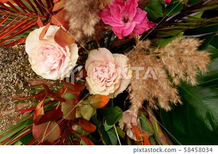 Floral decor.Composition of pampas grass with palm leaves. Floral decor.Composition of pampas grass with palm leaves. 58458034