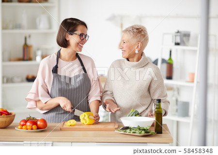 Family cooking together at home Family cooking together at home 58458348