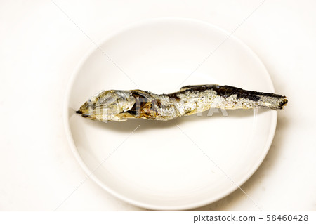 A single anchovy on a plate A single anchovy on a plate 58460428