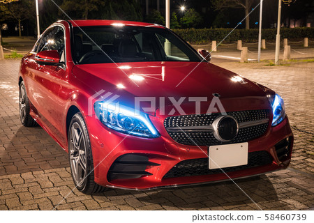 Wine red car and cityscape at night Wine red car and cityscape at night 58460739