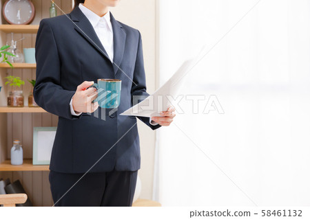 Business woman checking documents at home 58461132