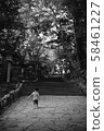 Back view of a child walking along the approach 58461227