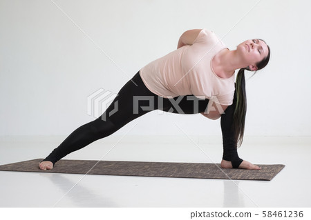 woman doing lunge exercise for spine, variation of utthita parshvakonasana 58461236