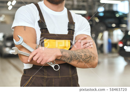 Male mechanic with muscular hands and tattoo... - Stock Photo [58463720] -  PIXTA