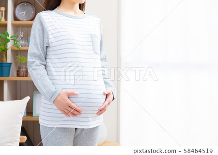 Pregnant woman waking up early morning Pregnant woman waking up early morning 58464519