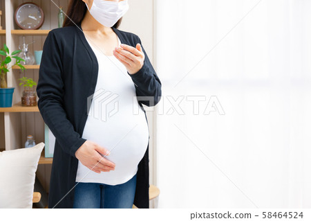 Unwell pregnant woman, sneezing, nausea, various symptoms 58464524