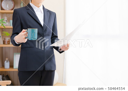 Business woman checking documents at home 58464554