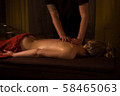 Body massage and spa treatment in modern salon 58465063
