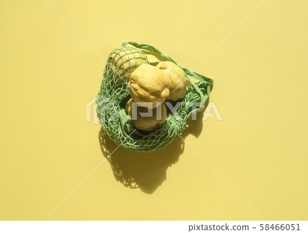 Quince fruits in eco-friendly canvas bag. Reusable 58466051