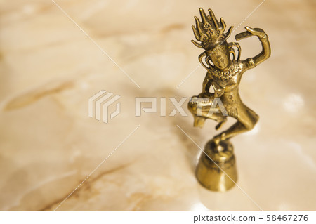 gold statue sharp marble background  58467276