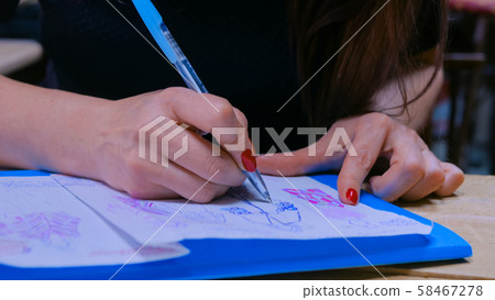 Fashion designer drawing design sketch 58467278