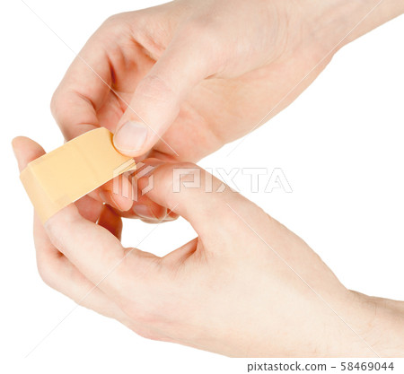 Adhesive bandage on finger 58469044