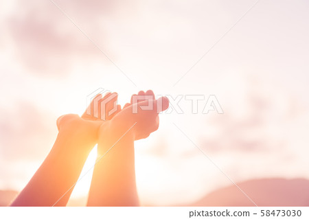 Woman hands place together like praying in front Woman hands place together like praying in front 58473030