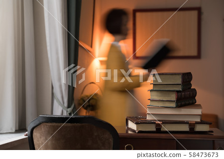 A woman reading a book A woman reading a book 58473673