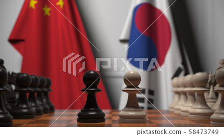 Chess game against flags of China and Korea. Political competition related 3D rendering Chess game against flags of China and Korea. Political competition related 3D rendering 58473749