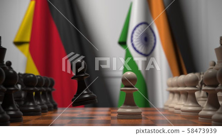 Chess game against flags of Germany and India. Political competition related 3D rendering 58473939