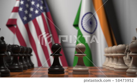Chess game against flags of USA and India. Political competition related 3D rendering 58473952
