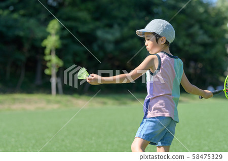 A boy playing in a park 58475329