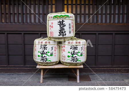 TAKAYAMA, JAPAN - May 9, 2015 - Takayama's well-known sake brewery displays for sale to tourists in front of the traditional house. 58475473