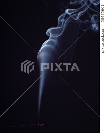 White smoke swirling on black background, close up 58475601