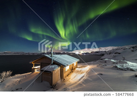 Wooden cottage on the background of the Northern Lights at night. Wooden cottage on the background of the Northern Lights at night. 58477668
