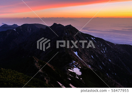Yatsugatake mountain climbing in spring: Dawn at the summit of Akadake Yatsugatake mountain climbing in spring: Dawn at the summit of Akadake 58477955