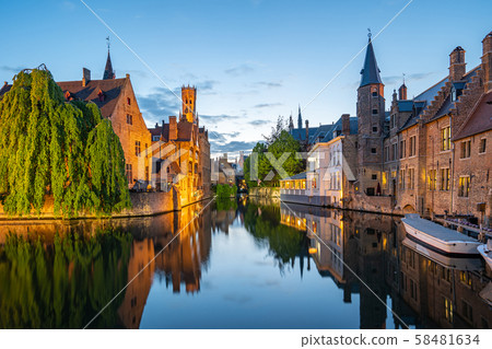 Bruges skyline with old buildings at twilight in Bruges, Belgium. 58481634