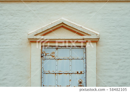 window in the old building 58482105