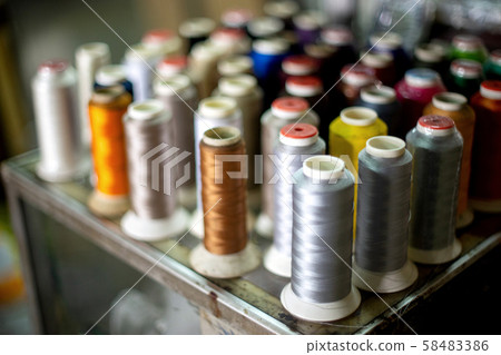 Many roll of bobbin thread colourful Many roll of bobbin thread colourful 58483386
