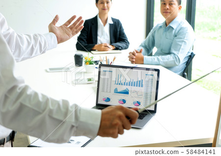 Young businessman stand in front of the group Young businessman stand in front of the group 58484141