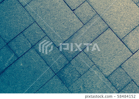 The sidewalk road made of natural stone is lined with mosaics of different colors The sidewalk road made of natural stone is lined with mosaics of different colors 58484152