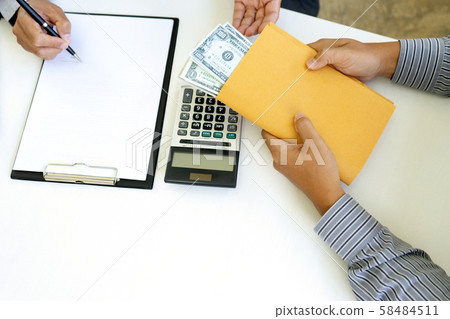 Business man give bribe 58484511